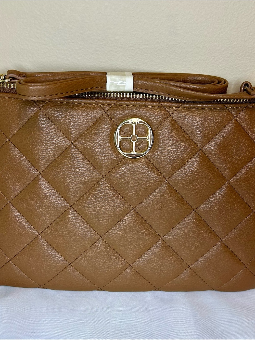 IMAN Quilted Tan Crossbody with Gold Medallion
